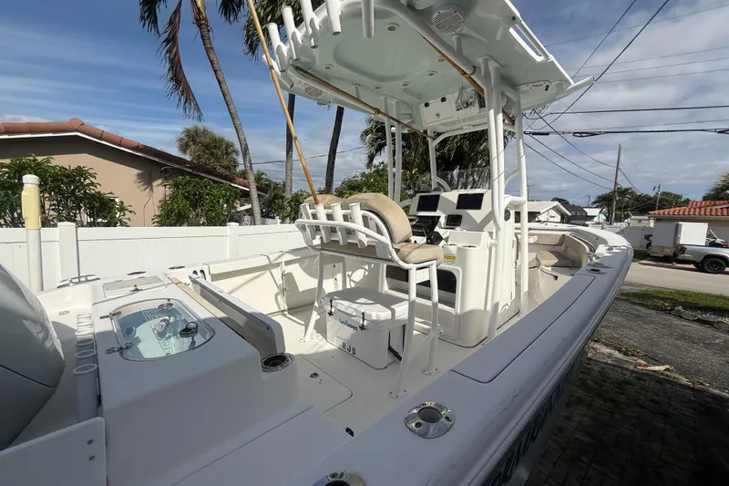 Slide: The Image of 2023 Sea Pro 219 Deep V CC boat with center console and seating, parked outdoors. - 8