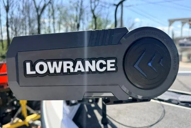 Slide: The Image of Lowrance device on 2022 Vexus VX21 boat, outdoor setting with trees in background. - 10