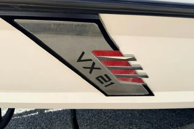 Slide: The Image of 2022 Vexus VX21 logo on boat exterior with sleek design elements. - 13
