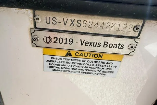 Slide: The Image of 2022 Vexus VX21 boat identification plate with caution label for mounting bolts. - 4