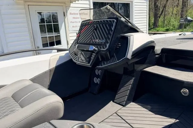 Slide: The Image of 2022 Vexus VX21 boat interior with sleek dashboard and comfortable seating. - 7