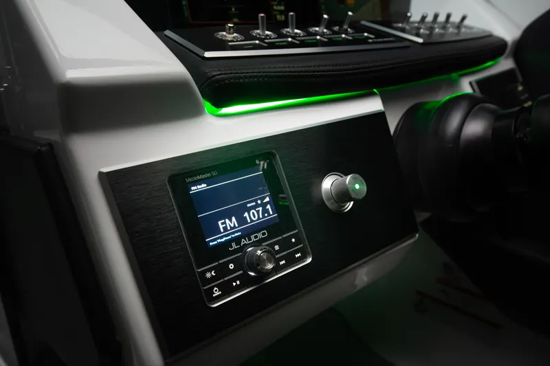 Slide: The Image of Dashboard of 2026 Four Winns H2 OB boat with JL Audio system. - 10