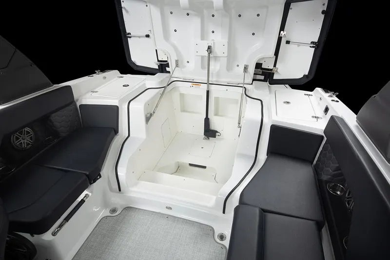 Slide: The Image of Manufacturer Provided Image: 2025 Four Winns H2 OB boat interior with open storage compartment and seating. - 15