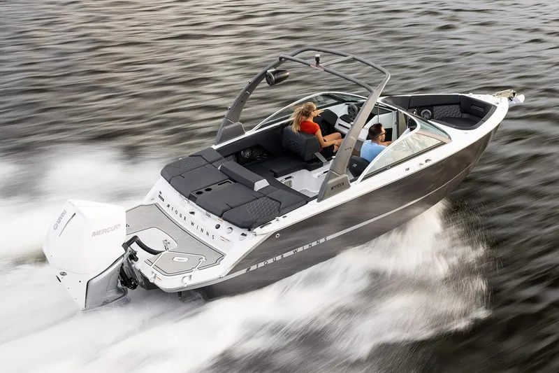 Slide: The Image of Manufacturer Provided Image: 2025 Four Winns H2 OB speedboat cruising on water with passengers. - 2