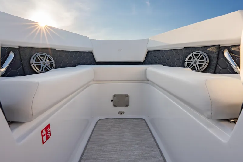 Slide: The Image of Interior of 2026 Four Winns H2 OB boat with white seating and speakers. - 21