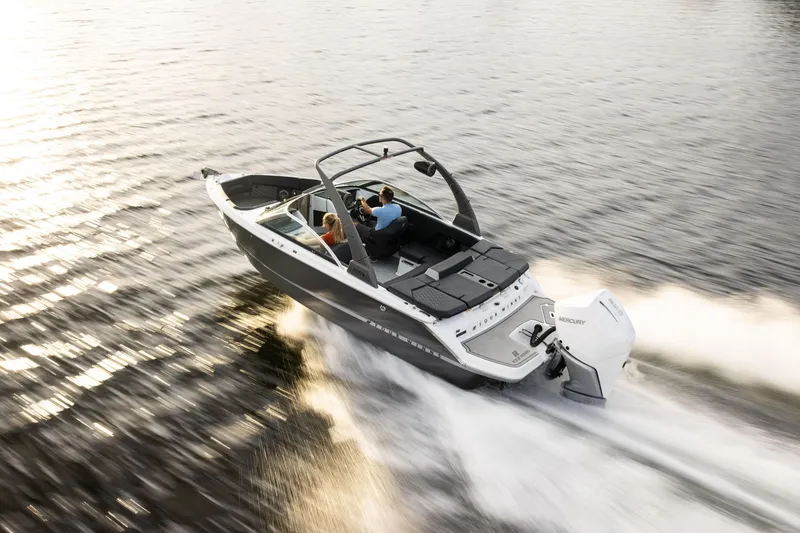 Slide: The Image of 2026 Four Winns H2 OB boat cruising on a sunlit lake. - 3