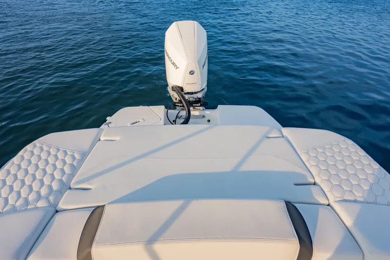 Slide: The Image of 2026 Four Winns H2 OB boat with outboard motor on calm water. - 16