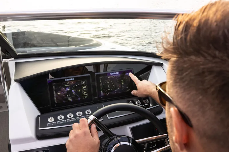 Slide: The Image of 2026 Four Winns H2 OB boat dashboard with touchscreen navigation system. - 4