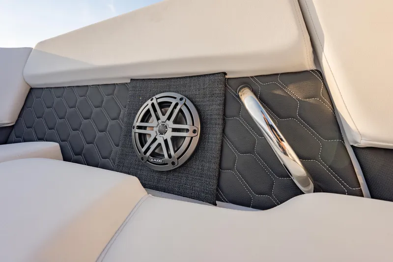 Slide: The Image of 2026 Four Winns H2 OB boat interior with hexagonal pattern upholstery and JL Audio speaker. - 27