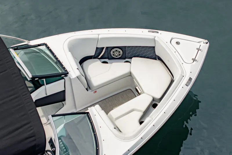 Slide: The Image of 2026 Four Winns H2 OB boat interior with white seating and modern design. - 14