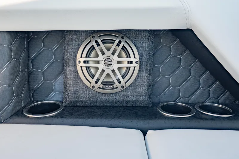 Slide: The Image of 2026 Four Winns H2 OB boat interior with JL Audio speaker and cup holders. - 28