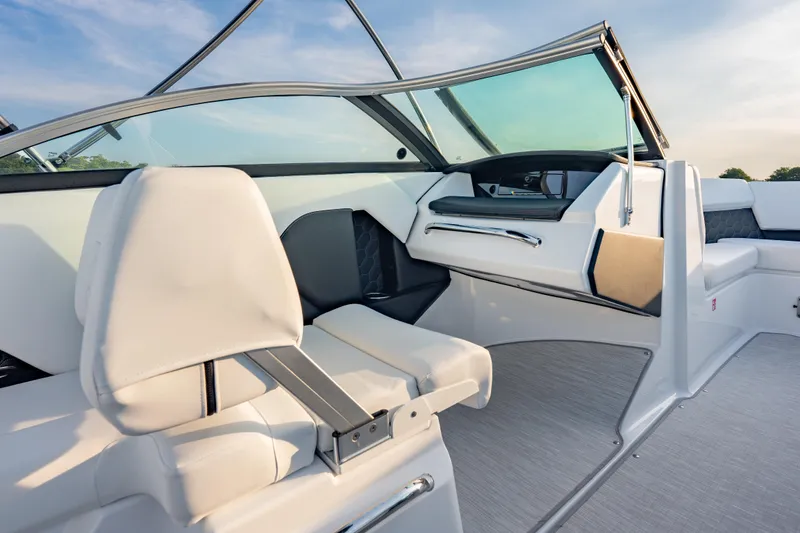 Slide: The Image of Interior of 2026 Four Winns H2 OB boat, featuring sleek seating and modern design. - 20