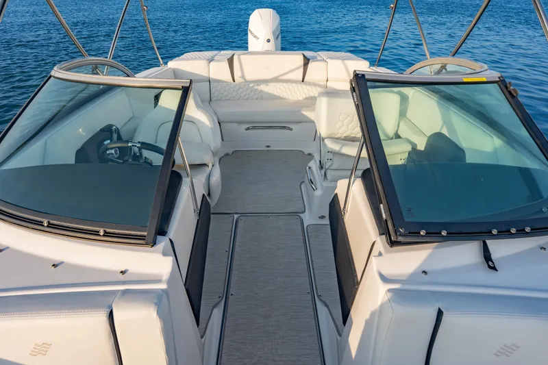 Slide: The Image of 2026 Four Winns H2 OB boat interior with sleek seating and modern design on water. - 18