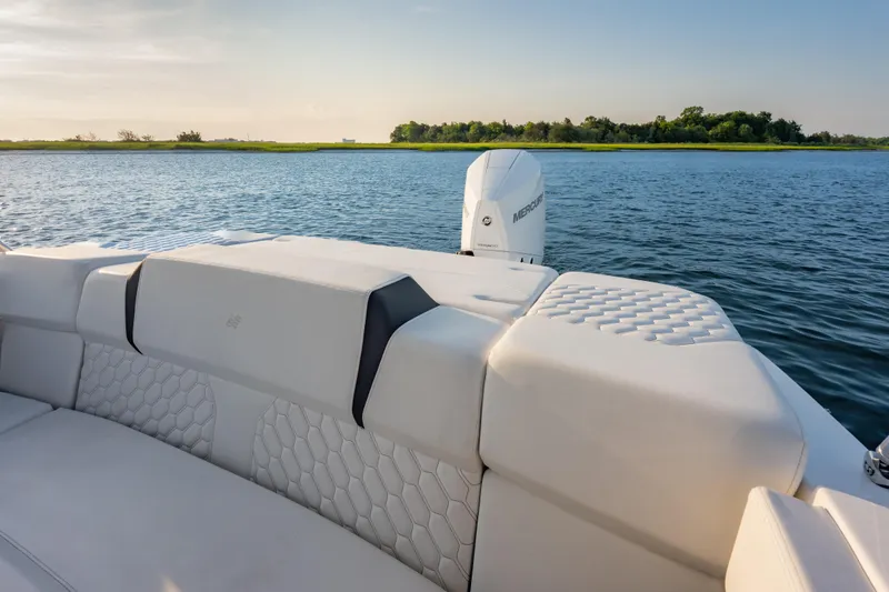 Slide: The Image of 2026 Four Winns H2 OB boat with luxurious seating on a serene lake. - 31