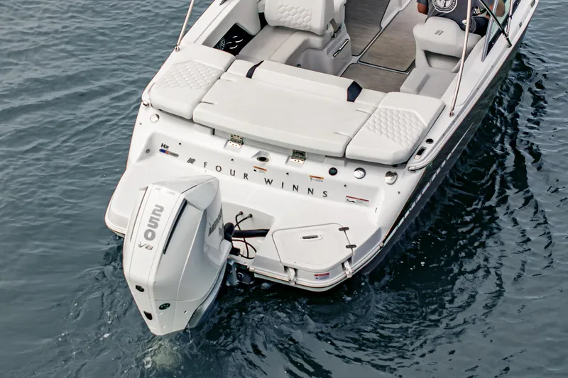 Slide: The Image of 2026 Four Winns H2 OB boat with outboard motor on water. - 15
