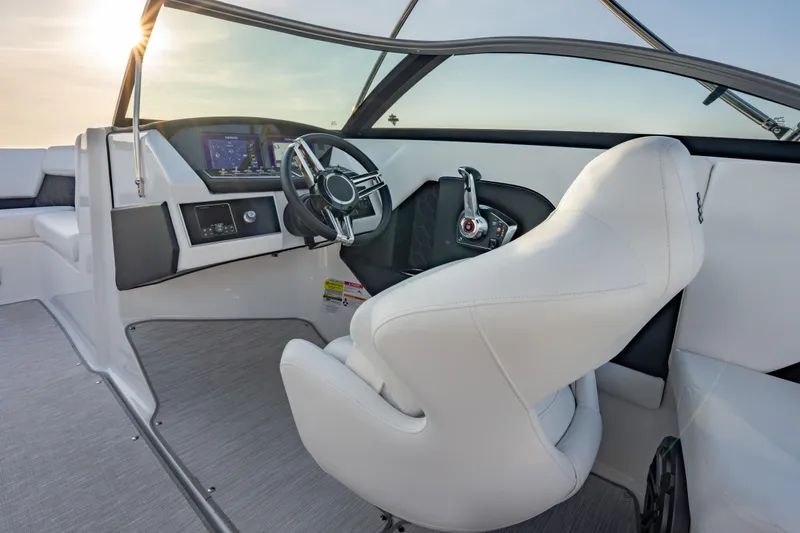 Slide: The Image of 2026 Four Winns H2 OB boat interior with modern steering and dashboard controls. - 22