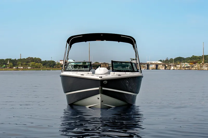 Slide: The Image of 2026 Four Winns H2 OB boat on calm water, front view. - 6