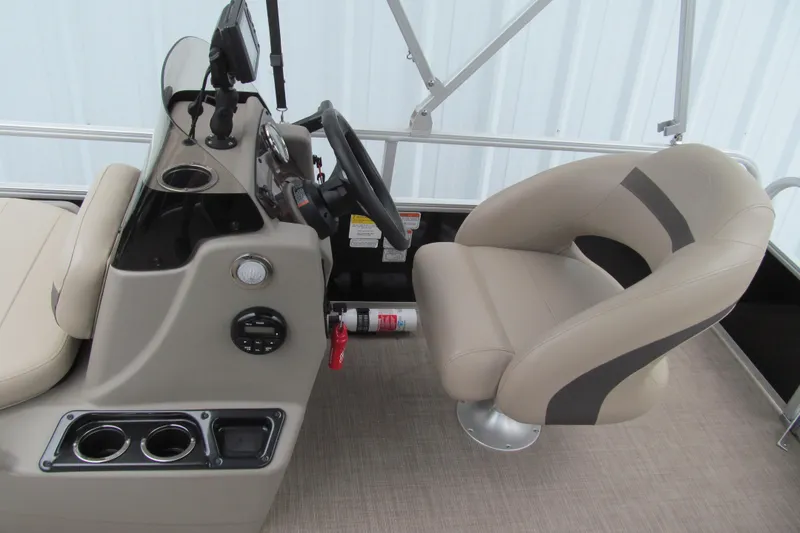 Slide: The Image of 2021 Sun Tracker Bass Buggy 16 XL boat interior with steering console and seating. - 11