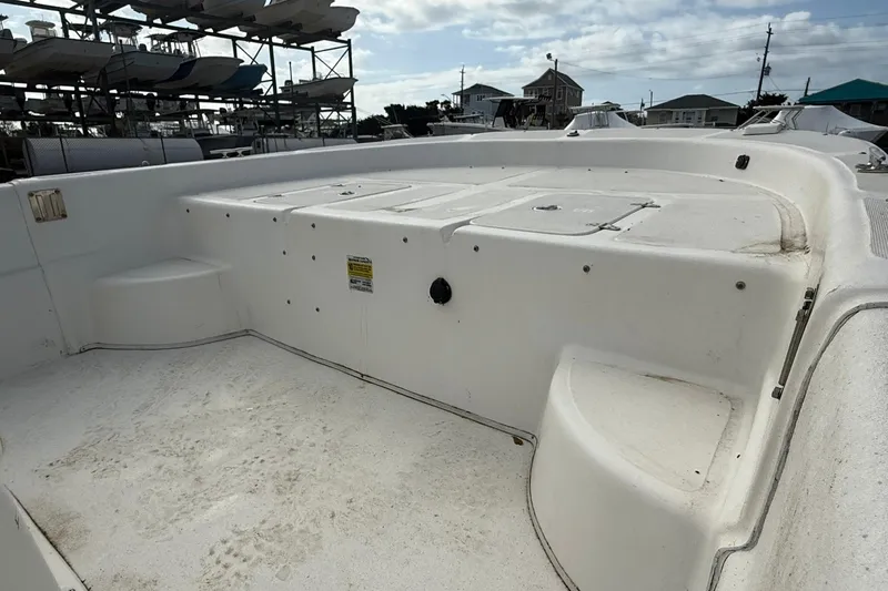 Slide: The Image of 2009 Carolina Skiff 198 DLV boat deck, white surface, outdoor storage setting. - 12