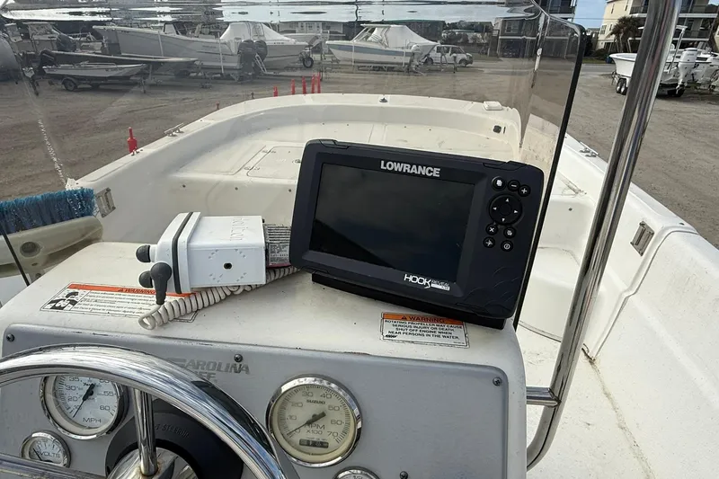 Slide: The Image of 2009 Carolina Skiff 198 DLV boat dashboard with Lowrance GPS and gauges. - 16