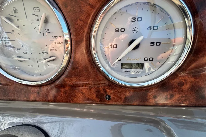 Slide: The Image of Close-up of 2014 Rinker 290 Express Cruiser dashboard gauges. - 11