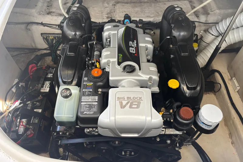 Slide: The Image of Engine compartment of a 2014 Rinker 290 Express Cruiser with a Big Block V8 engine. - 27