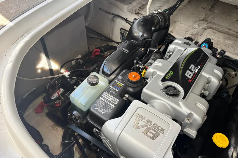 Slide: The Image of 2014 Rinker 290 Express Cruiser engine compartment with MerCruiser 8.2L V8 engine. - 28