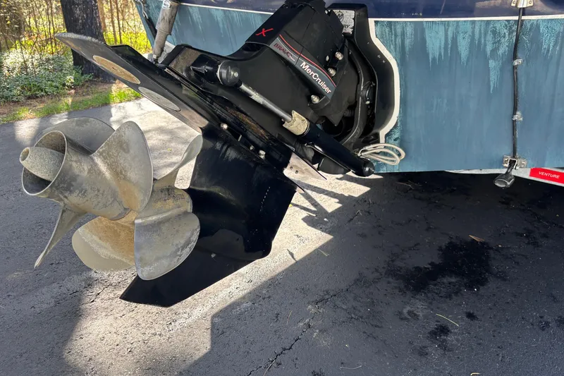 Slide: The Image of 2014 Rinker 290 Express Cruiser with MerCruiser outdrive and propeller detail. - 32