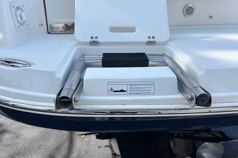 Slide: The Image of 2014 Rinker 290 Express Cruiser swim platform with stainless steel ladder. - 33