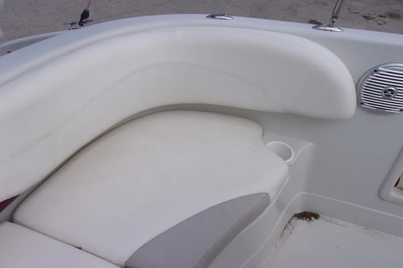Slide: The Image of White seating area on a 2008 Tahoe 215 CC boat interior. - 10