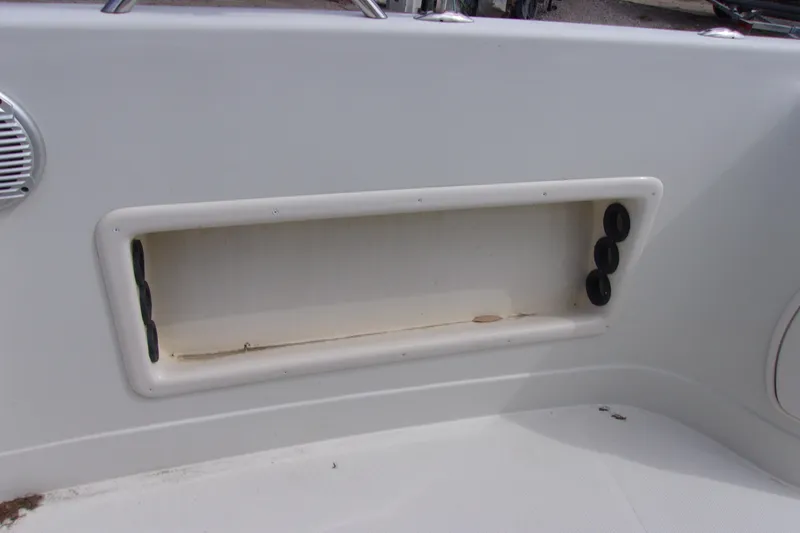 Slide: The Image of Storage compartment on a 2008 Tahoe 215 CC boat interior. - 12