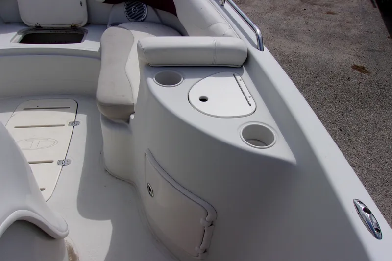 Slide: The Image of 2008 Tahoe 215 CC boat interior with seating and storage compartments. - 13