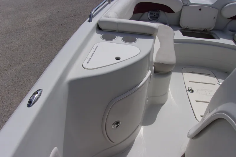 Slide: The Image of 2008 Tahoe 215 CC boat interior with seating and storage compartments. - 14