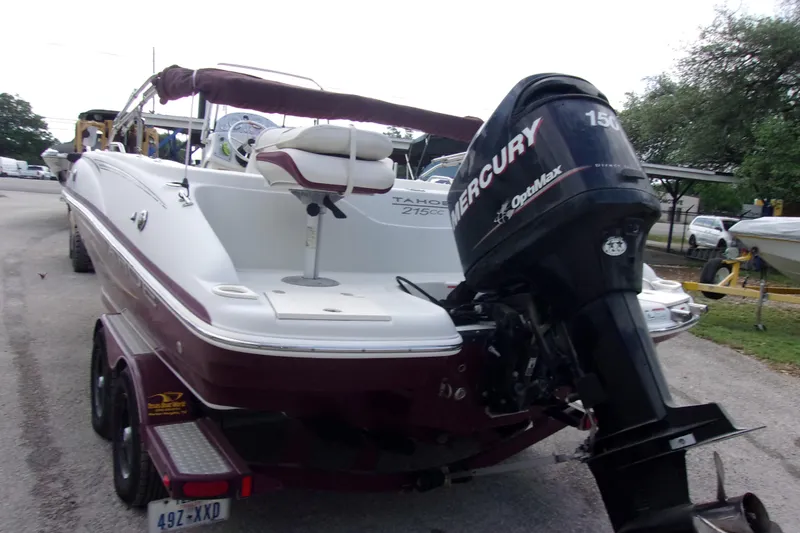 Slide: The Image of 2008 Tahoe 215 CC boat with Mercury OptiMax engine on trailer. - 5