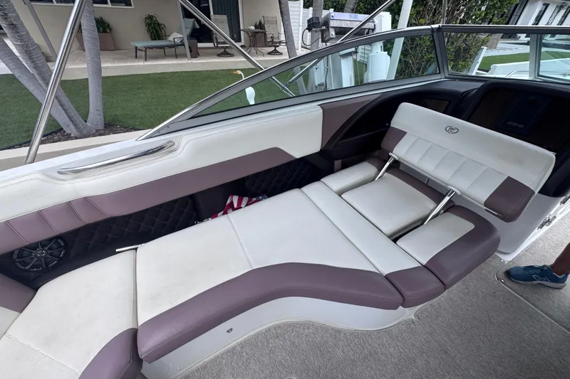 Slide: The Image of Interior of a 2013 Cobalt 296 boat with plush seating and modern design. - 24