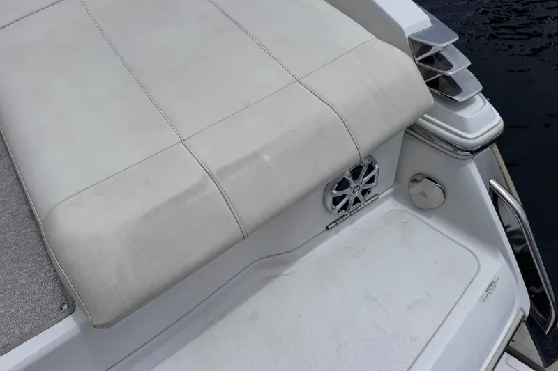 Slide: The Image of Rear deck of a 2013 Cobalt 296 boat with cushioned seating and speaker. - 31