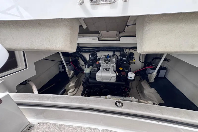 Slide: The Image of Engine compartment of a 2013 Cobalt 296 boat featuring a powerful V8 engine. - 33