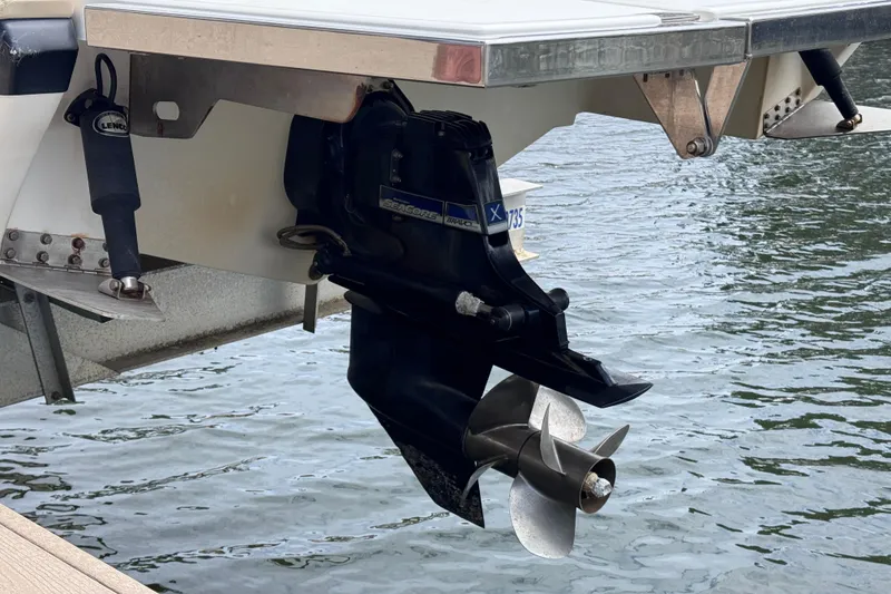 Slide: The Image of 2013 Cobalt 296 boat stern with outboard motor and propeller in water. - 37