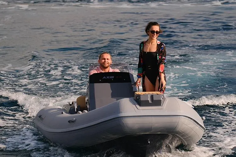 Slide: The Image of Two people enjoying a ride on a 2026 Northstar Axis 4.8 inflatable boat. - 3