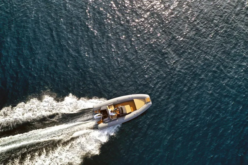 Slide: The Image of Aerial view of 2026 Northstar Axis 4.8 boat cruising on open water. - 4