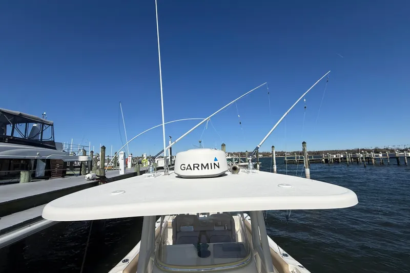 Slide: The Image of 2016 Key West Billistic 281 Center Console boat docked with Garmin equipment. - 13