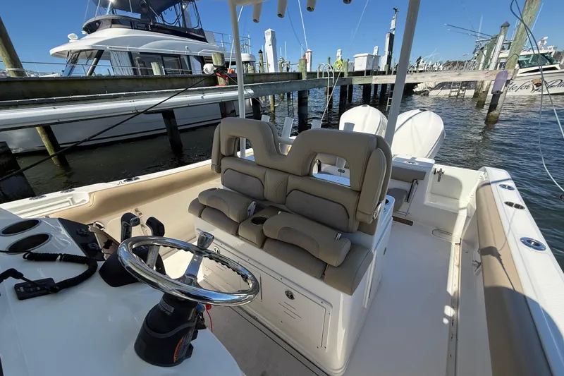 Slide: The Image of 2016 Key West Billistic 281 Center Console boat interior at marina. - 14