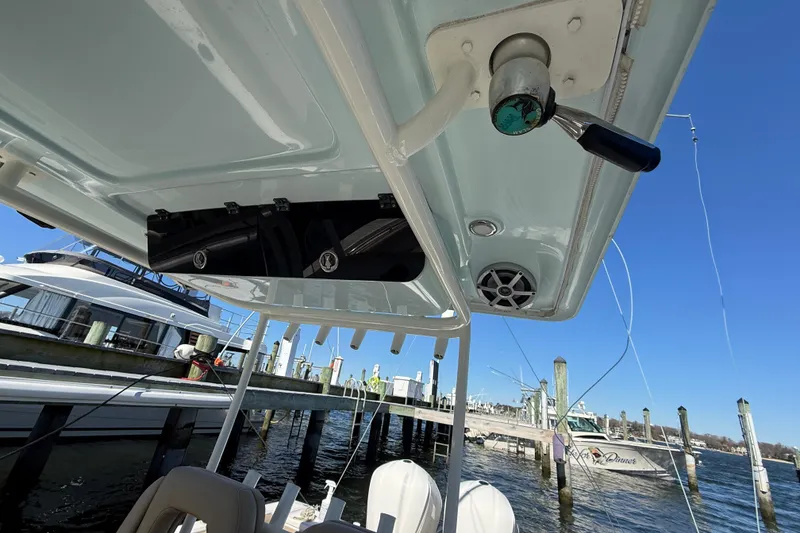 Slide: The Image of 2016 Key West Billistic 281 Center Console boat docked at marina, clear blue sky. - 19