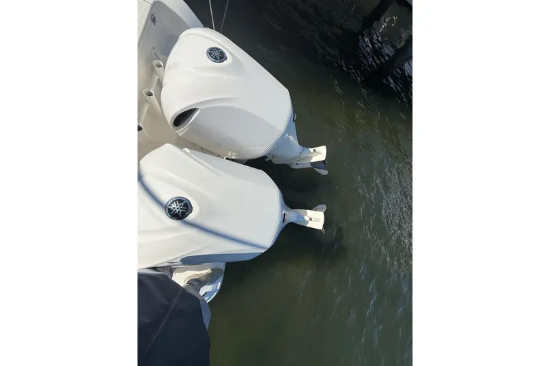 Slide: The Image of Twin outboard engines on a 2016 Key West Billistic 281 Center Console boat. - 22