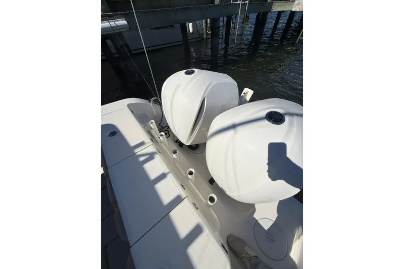 Slide: The Image of 2016 Key West Billistic 281 Center Console with dual outboard engines docked. - 4