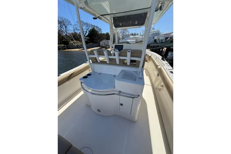 Slide: The Image of 2016 Key West Billistic 281 Center Console boat interior with seating and storage. - 5