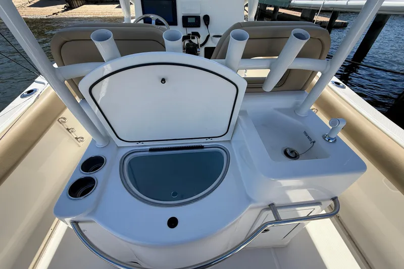 Slide: The Image of 2016 Key West Billistic 281 Center Console boat with fishing rod holders and sink. - 8