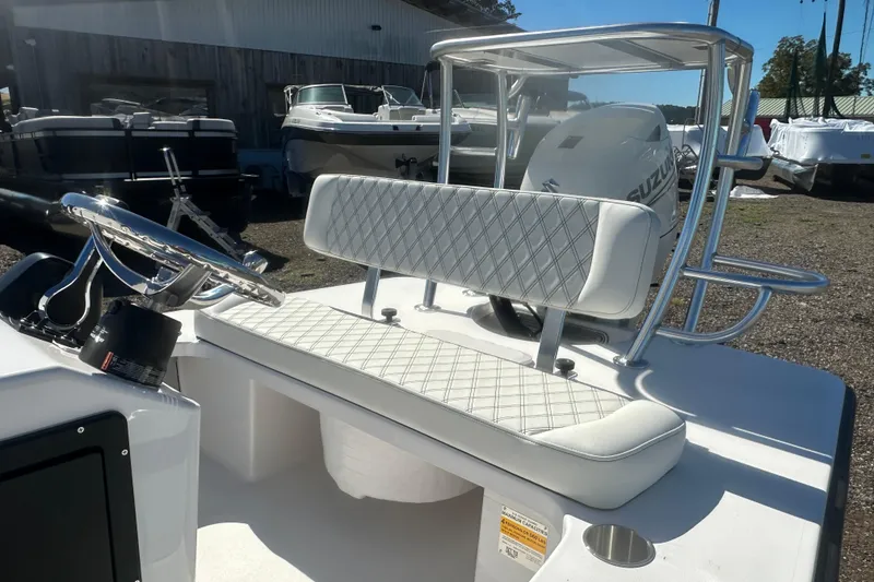 Slide: The Image of 2026 Delta Boatworks Delta D18 interior with steering wheel and cushioned seating. - 12