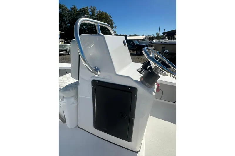 Slide: The Image of 2026 Delta Boatworks Delta D18 console with steering wheel and storage compartment. - 13