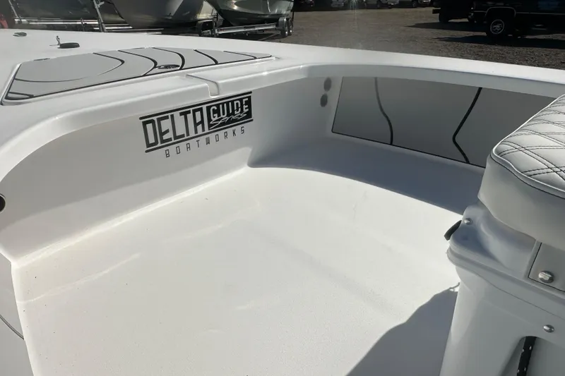 Slide: The Image of 2026 Delta Boatworks Delta D18 interior with seating and logo detail. - 14